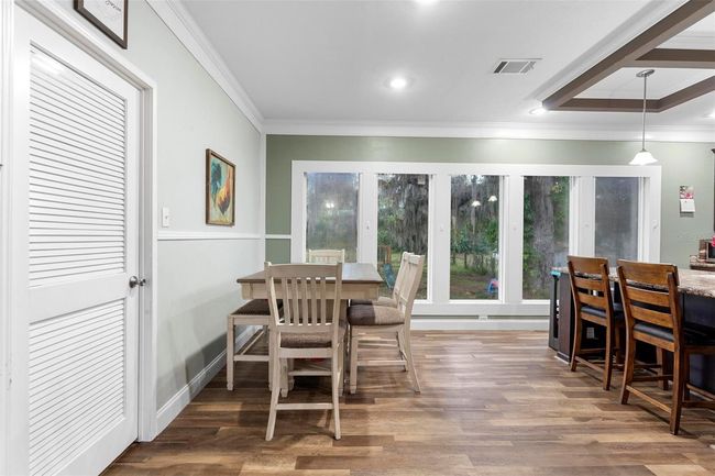 Tall glass windows overlooking the backyard | Image 8