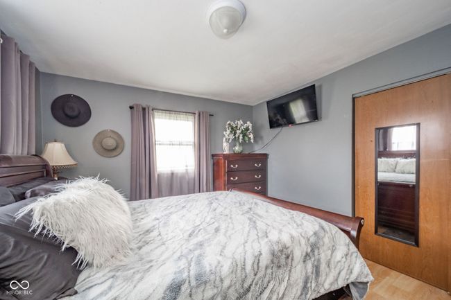 bedroom featuring wood finished floors | Image 13