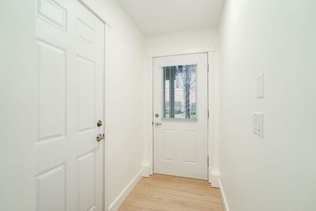 Doorway with light wood finished floors and baseboards | Image 36