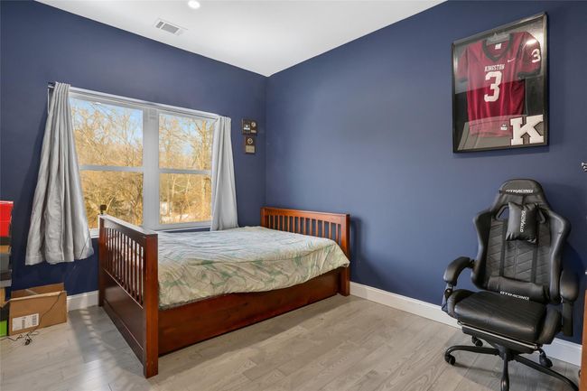 Bedroom with wood-type flooring | Image 20