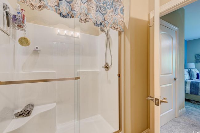 Full bath featuring curtained shower and vanity | Image 21