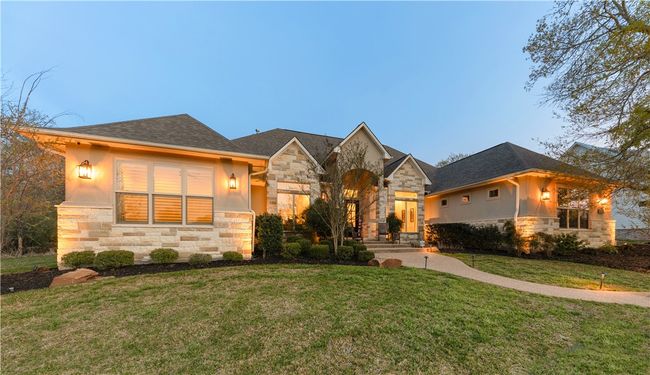 View of front of house with a front lawn and stone siding | Image 8