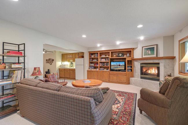 Family room extends to wet bar, 2nd refrigerator, and space for a second kitchen. and | Image 33