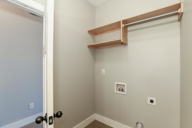 Washroom featuring hookup for a washing machine and hookup for an electric dryer | Image 15