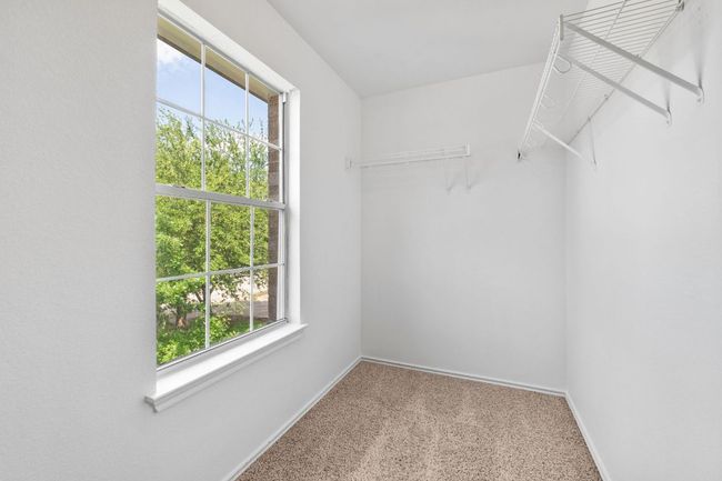Spacious closet featuring carpet | Image 32