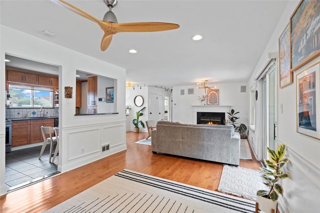 Kitchen featuring stainless steel appliances, recessed lighting, plenty of natural light, tasteful backsplash, and brown cabinets | Image 13
