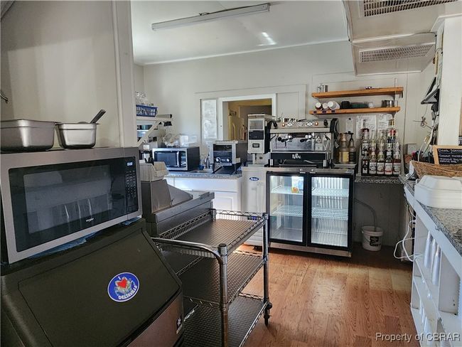 Serving and prep area. Equipment and supplies are the property of the current lessee and may be purchased separately. Please ask about items of interest that may or may not be for sale outside of the real property. | Image 13