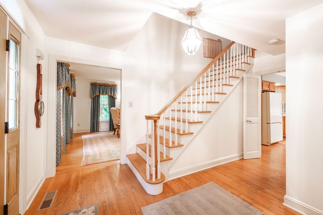 Spacious foyer featuring beautiful hardwood flooring | Image 8