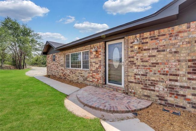 Doorway to property with a yard | Image 10