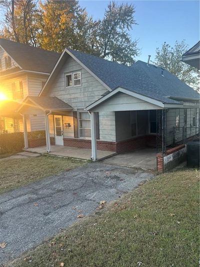 Rear view of property with a yard and a carport | Image 3