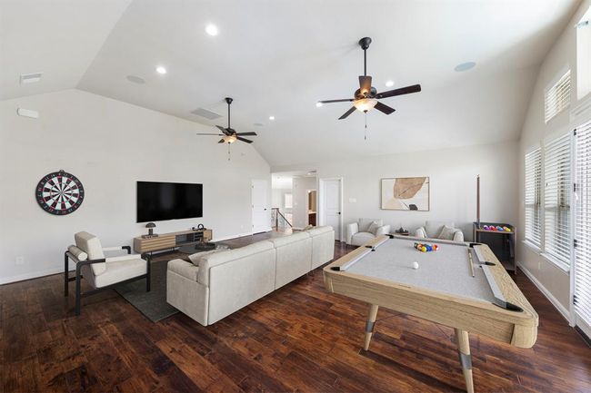 With room for lounging, games, and media, this upstairs retreat is the ultimate multi-use space—perfect for movie nights, friendly competition, and effortless entertaining. *This photo has been virtually staged.* | Image 30