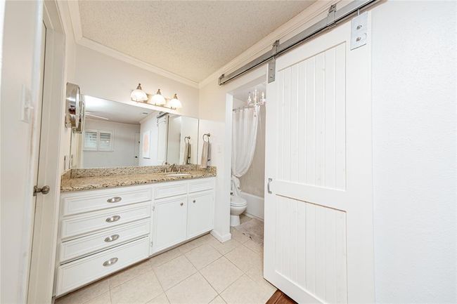 Slide the barn door closed for privacy to your shower and toilet area. | Image 16