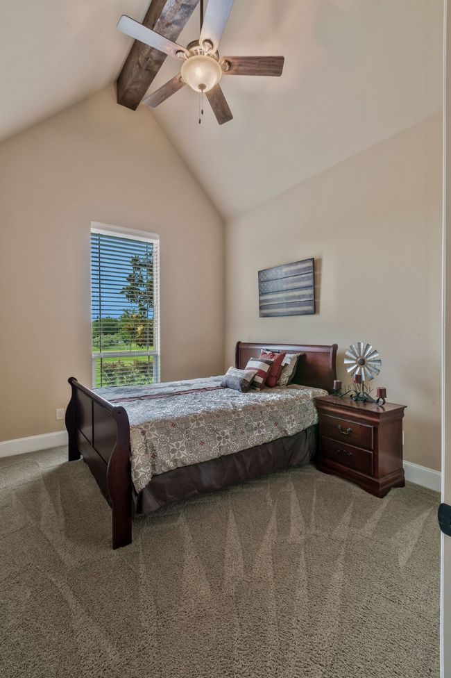 Bedroom featuring carpet and ceiling fan | Image 24