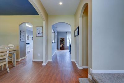 Walking in the home you will see the open flow floor plan and luxury vinyl flooring that flows through the first floor. | Image 2