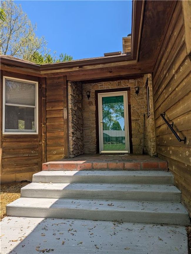 Entrance to property with stone siding | Image 5