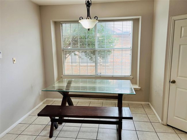 View of tiled dining space | Image 12