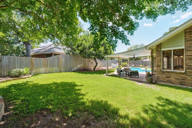 Fenced backyard featuring a patio | Image 29
