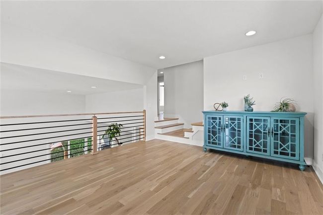 Empty room featuring wood finished floors and recessed lighting | Image 26