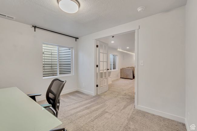 Office featuring carpet floors and french doors | Image 29