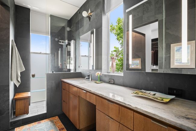 Armani countertops, plumbed for a second sink, complete with electrical plugins built inside of the cabinets. | Image 18