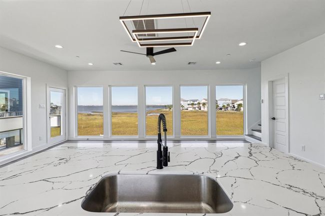 Wash the dishes while watching the boats go by from the kitchen sink offering captivating bay views | Image 9