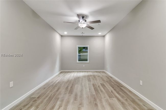 Spare room with light hardwood / wood-style floors and ceiling fan | Image 30