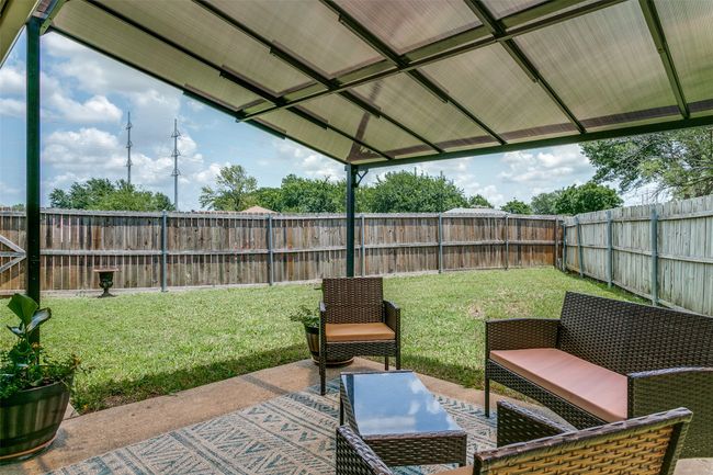 Fenced backyard featuring outdoor lounge area and a patio area | Image 26