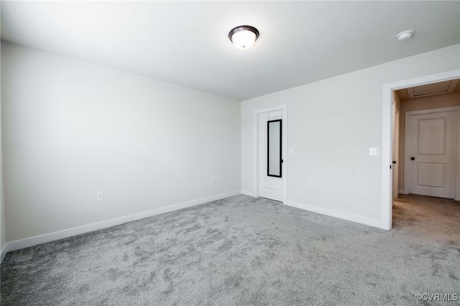 Empty room featuring a smoke detector and carpet flooring | Image 32