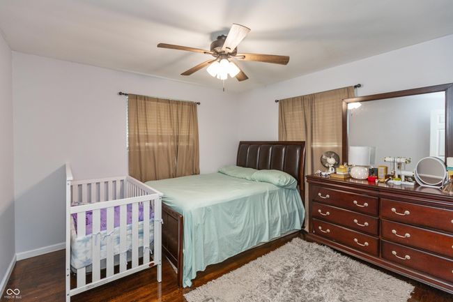 bedroom with wood finished floors and a ceiling fan | Image 14