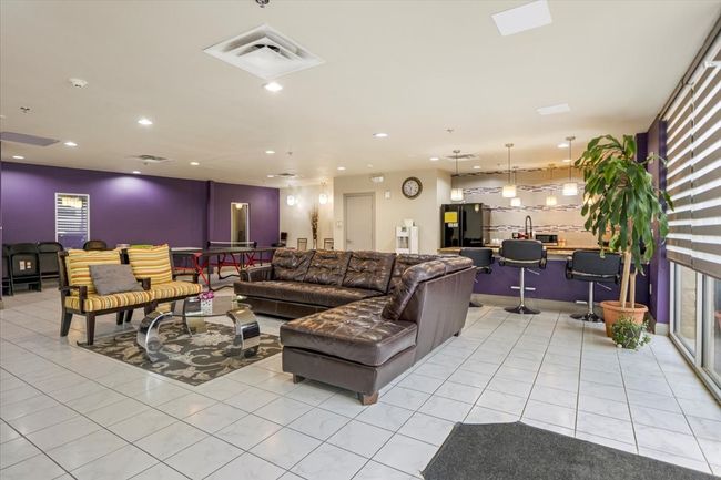 Living area featuring light tile patterned flooring and recessed lighting | Image 14