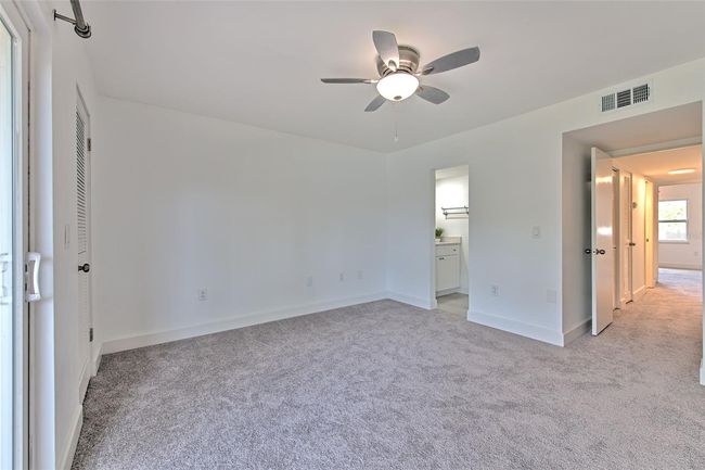 Upstairs primary bedroom with balcony | Image 13
