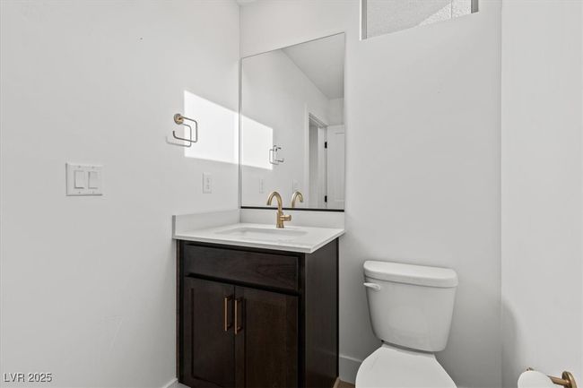 Half bath with toilet, vanity, and baseboards | Image 30