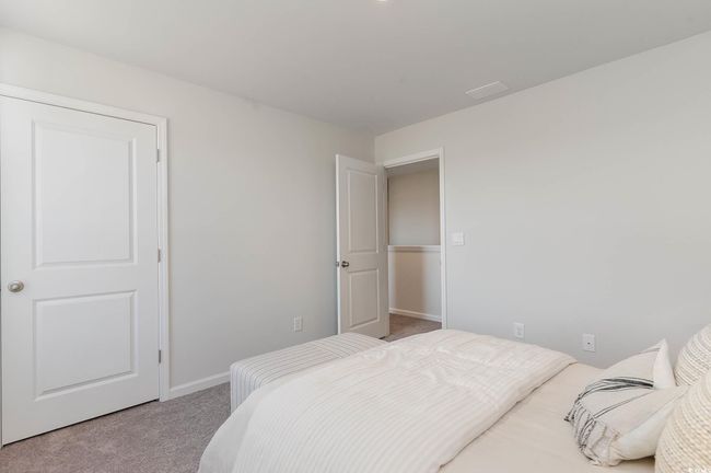 Bedroom featuring carpet floors and baseboards | Image 24