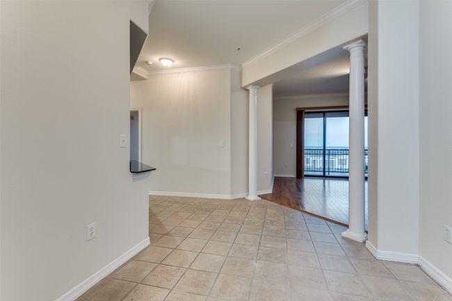 From the moment you step through the front door, you're greeted by jaw-dropping views that stretch across Lake Carolyn, Las Colinas, and the Dallas skyline—setting the tone for the elevated living experience that awaits throughout this stunning condo. | Image 24