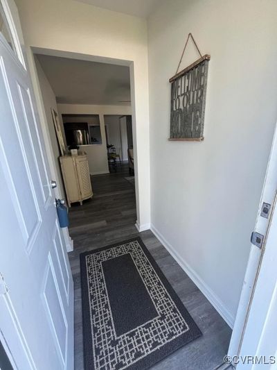 Hallway with dark hardwood / wood-style flooring | Image 3