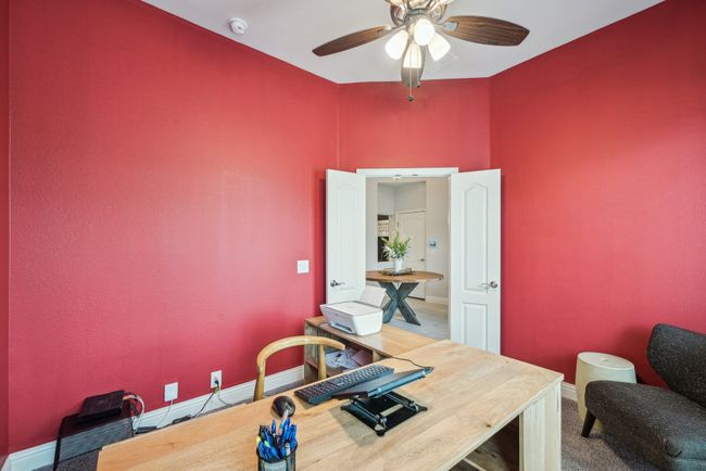 4th bedroom is being used as Home office featuring ceiling fan, carpet, big closet, double doors | Image 9