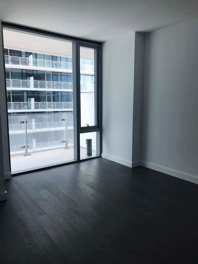 Empty room featuring wood finished floors and baseboards | Image 5