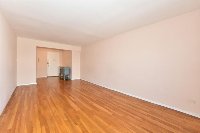 Unfurnished living room with light wood-type flooring | Image 11