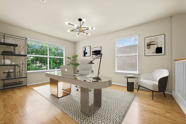 Home office with light wood-style floors, healthy amount of natural light, and a chandelier | Image 5