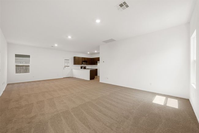 Unfurnished living room featuring recessed lighting and light carpet | Image 11