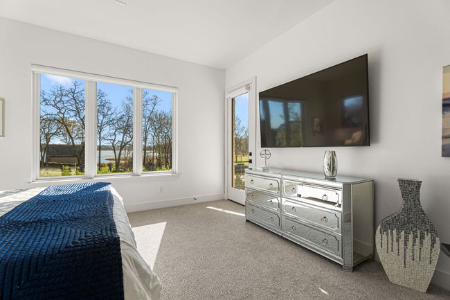 Carpeted bedroom featuring baseboards | Image 23