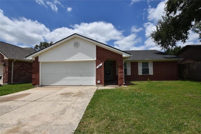 This red brick home with white shutters and trim offers a timeless appeal that transcends architectural trends. | Image 6