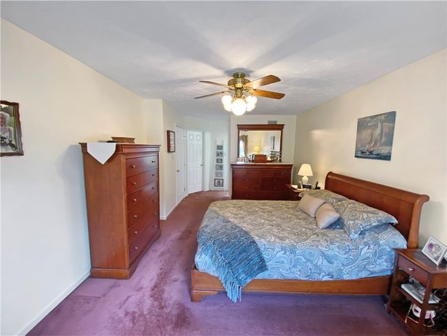 The master bedroom features a walk-in closet and en-suite bath. | Image 14