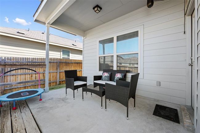 View of patio featuring an outdoor hangout area | Image 30