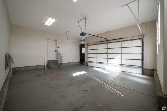 Garage featuring a garage door opener | Image 34