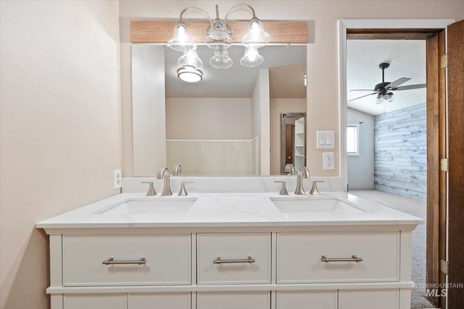 Bathroom with double vanity and a ceiling fan | Image 21