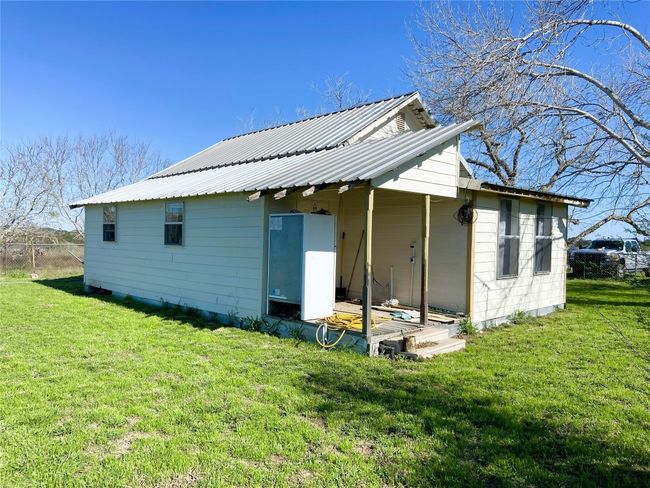 Back of home with fenced yard | Image 28