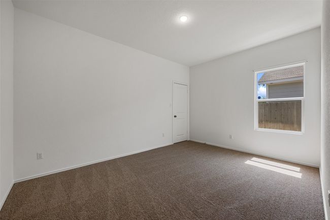 Spare room with dark carpet and baseboards | Image 27