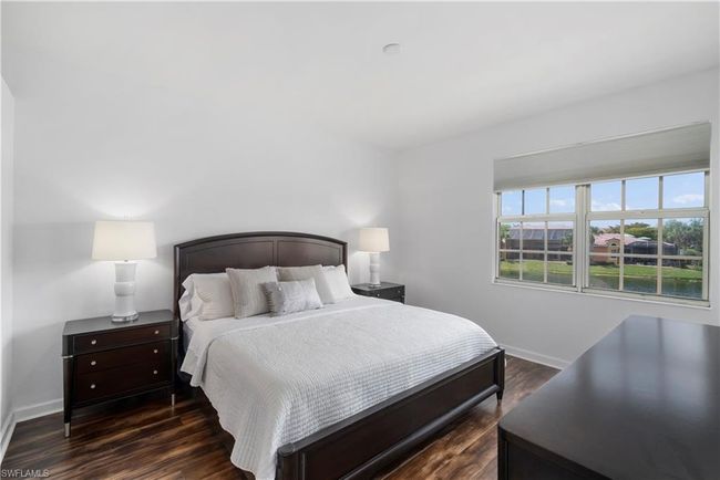 Main bedroom with dark hardwood / wood-style floors | Image 9