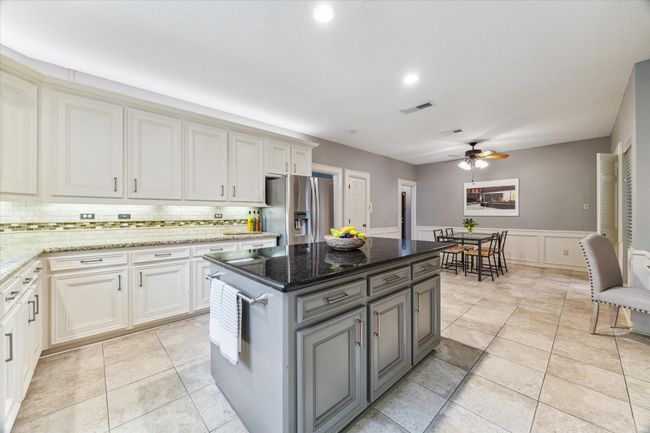 This last kitchen photo shows the large breakfast area in the background. | Image 12